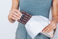 Female's hands holding and breaking tasty dark chocolate