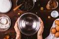 Female's hands holding empty metal bowl Royalty Free Stock Photo