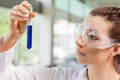 Female science student looking at a test tube Royalty Free Stock Photo