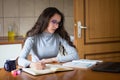 Female science student preparing for exams at home