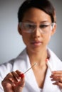 Female Scientist Collecting DNA Sample On Swab