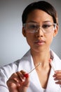 Female Scientist Collecting DNA Sample On Swab