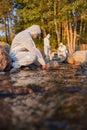 Female scientist collecting water sample from sea Royalty Free Stock Photo