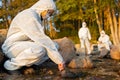 Female scientist collecting water sample from sea Royalty Free Stock Photo