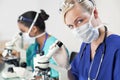 Female Scientist or Doctor Using Microscope Royalty Free Stock Photo