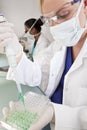 Female Scientist & Green Samples in Laboratory Royalty Free Stock Photo