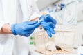 Female scientist hand using syringe