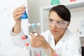 Female scientist looking at dna chain Royalty Free Stock Photo
