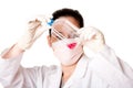 Female scientist looking at tissue culture flask Royalty Free Stock Photo