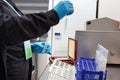 Female scientist preparing slides for karyotype and fluorescence in situ hybridization at the laboratory