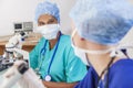 Female Scientist Research Team Using Microscopes in Laboratory Royalty Free Stock Photo