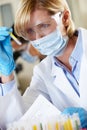 Female Scientist Studying Test Tube In Laboratory