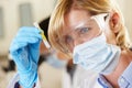 Female Scientist Studying Test Tube In Laboratory