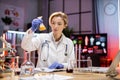 Female scientist working in modern lab. Doctor making microbiology research. Royalty Free Stock Photo