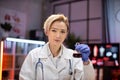 Female scientist working in modern lab. Doctor making microbiology research. Royalty Free Stock Photo