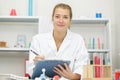 female scientist writing on clipboard Royalty Free Stock Photo