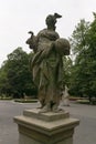 Female sculpture rococo style with and orb in her hand in middle of saxon gardens