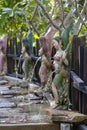 Female sculpture, statue in the tropical garden decorated in asian style, Thailand Royalty Free Stock Photo