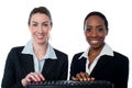 Female secretaries typing in keyboard Royalty Free Stock Photo