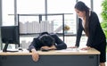 Female secretary awakens the boss to sleep on the work desk Royalty Free Stock Photo