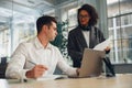 Female secretary brought documents to the boss for signing during working day