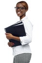 Female secretary carrying office files Royalty Free Stock Photo