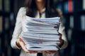 An accountant carries a stack of documents in his hands. A female secretary holds a stack of papers in her hands. Concept: Office Royalty Free Stock Photo