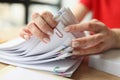 Female secretary looks through fastened papers in office Royalty Free Stock Photo