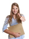 Female secretary with blond hair showing thumb Royalty Free Stock Photo