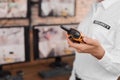 Female security guard with portable transmitter at workplace, closeup Royalty Free Stock Photo