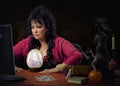 Female seer predicts online with big crystal egg