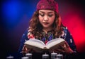 Female seer teller doing psychic reading book