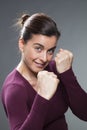 Female self-defense concept for attractive 30s woman