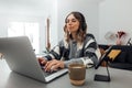 Female self employee doing online job at home office Royalty Free Stock Photo