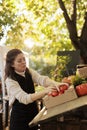 Female seller fresh fruits and vegetables stand owner Royalty Free Stock Photo