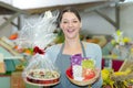 female seller offering large box chocolates Royalty Free Stock Photo