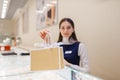 Female seller with shopping bags in jewelry store