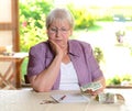 Female senior is calculating her budget Royalty Free Stock Photo