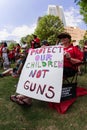 Female Senior Citizen Holds Anti Gun Sign At Atlanta Rally