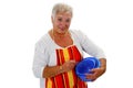 Female senior housewife with bowls and eggbeater