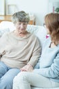 Female senior talking with caregiver