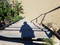 Female shadow on stairs to beach in Isabela, Puerto Rico Royalty Free Stock Photo