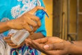 Female sharing hand sanitizer for washing hands - the new normal