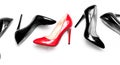 Female shiny red and black stilettos on a white background