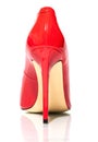 Female shiny red stilettos on a white background Royalty Free Stock Photo