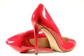 Female shiny red stilettos on a white background Royalty Free Stock Photo