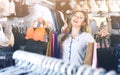 Female shopper boasting her purchases in underwear shop