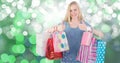 Female showing thumbs up while carrying colorful shopping bags Royalty Free Stock Photo
