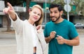 Female is showing to latino tourist the way to hotel Royalty Free Stock Photo