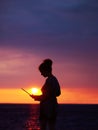 Female silhouette with laptop on sunset Royalty Free Stock Photo